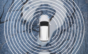 Car surrounded by radar signal over a question mark in the road.