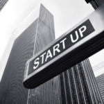 A street sign that says "Start Up."