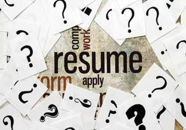 Resume written on a background with question mark papers on top of the words.
