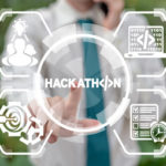 Image of a man holding his hand out, words say hackathon with symbols.